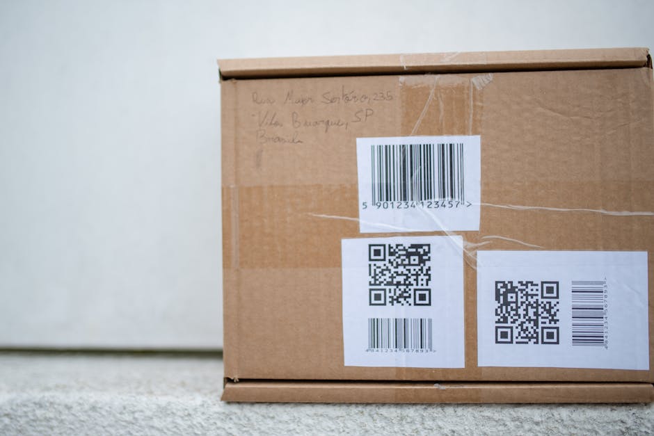 Close-up of a cardboard package with QR codes and a barcode, ideal for delivery and shipping concepts.