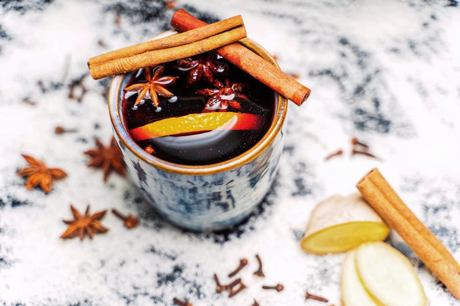 Delightful spiced drink with cinnamon sticks, star anise, and citrus slices. Perfect for cozy seasons.