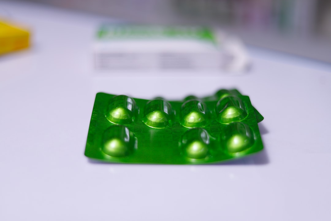 a group of green pills sitting on top of a table