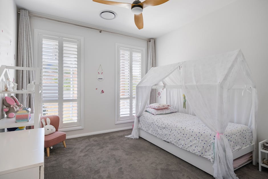 Bright and cozy child's bedroom with a canopy bed, toys, and decor. Perfect for a warm and inviting atmosphere.
