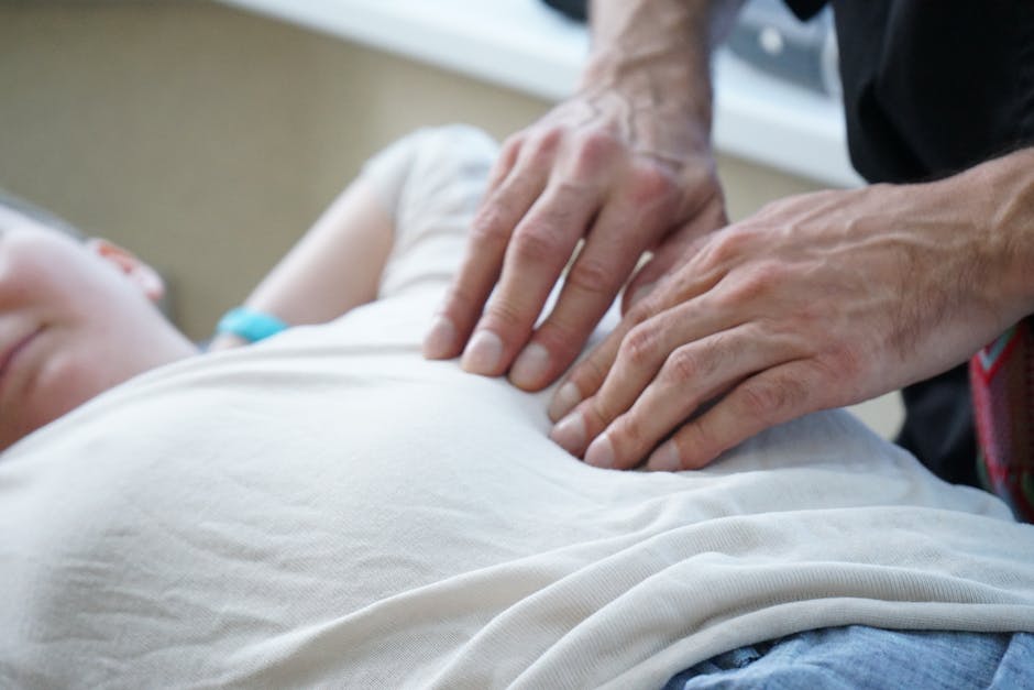 Close-up of hands performing a therapeutic massage indoors, enhancing relaxation and stress relief.