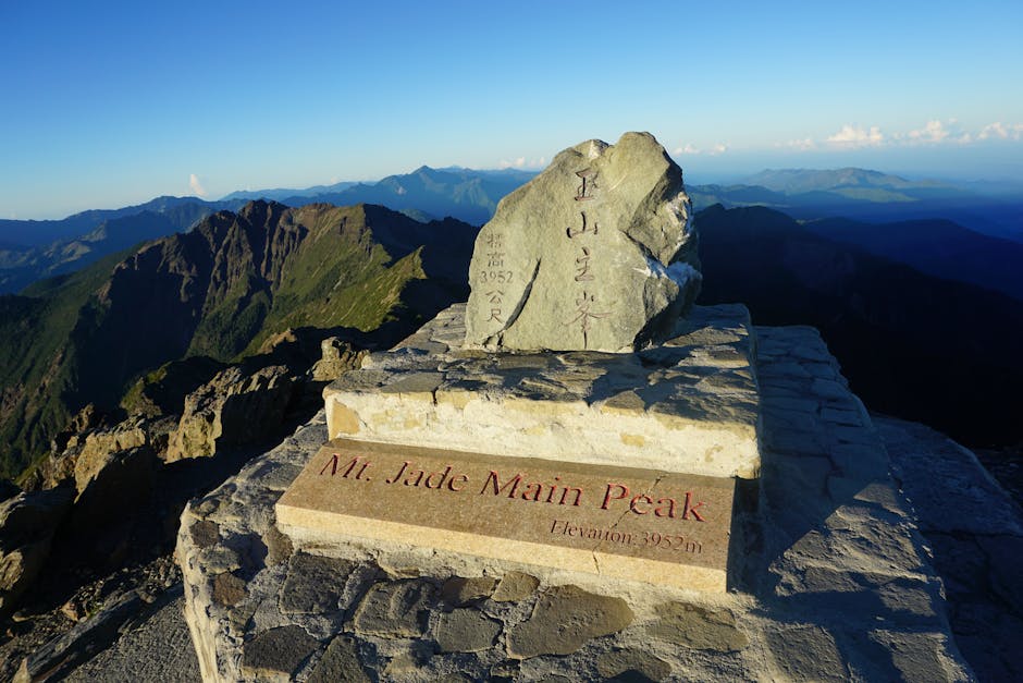 Experience the breathtaking Mt. Jade Main Peak in Taiwan at sunrise, highlighting its majestic elevation.