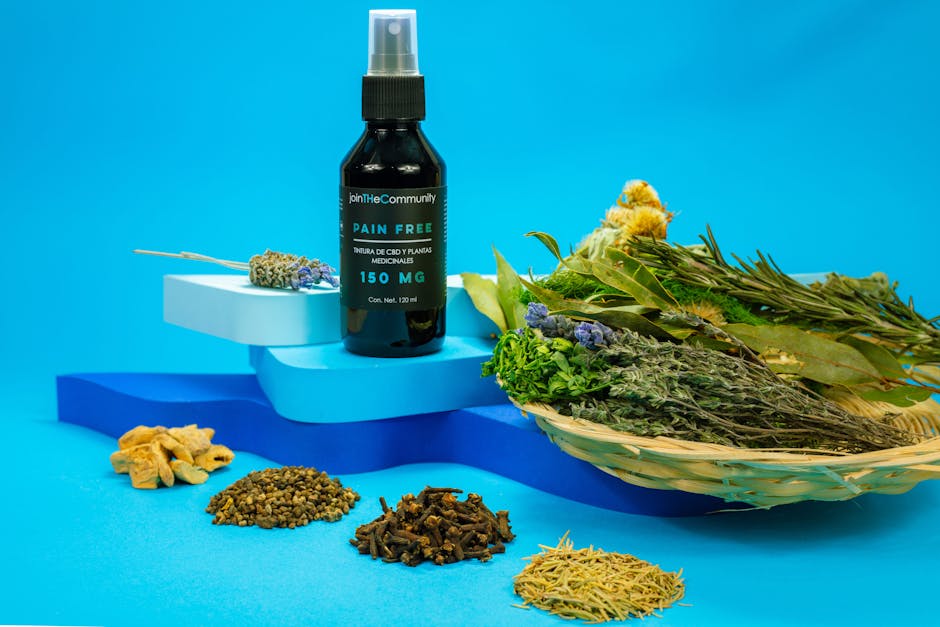 A black spray bottle of herbal pain relief with natural ingredients on a blue background.