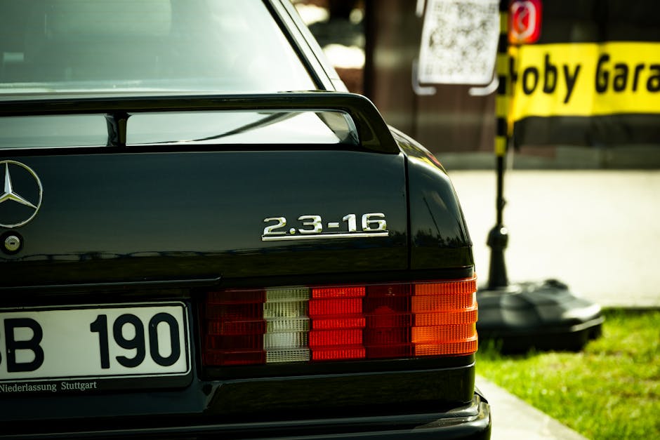 Close-up of a classic Mercedes-Benz 2.3-16 car tail light in a street scene in Ankara, Türkiye.